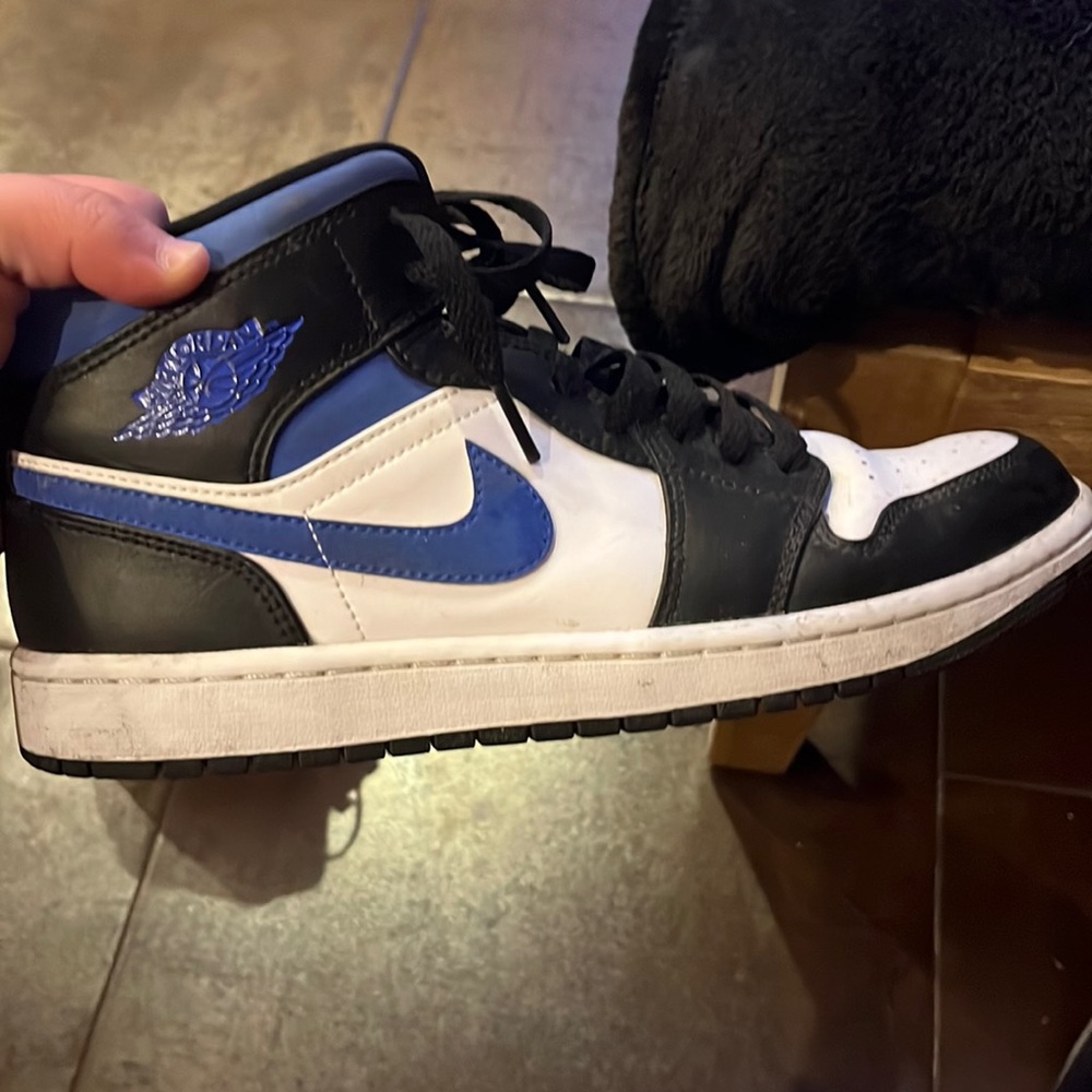 - Blue and white Air Jordan 1 Mid sized 8.5 men’s